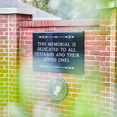 plaque that reads: This memorial is dedicated to all veterans and their loved ones