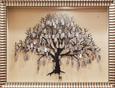 framed tree with military dog tags hanging on it