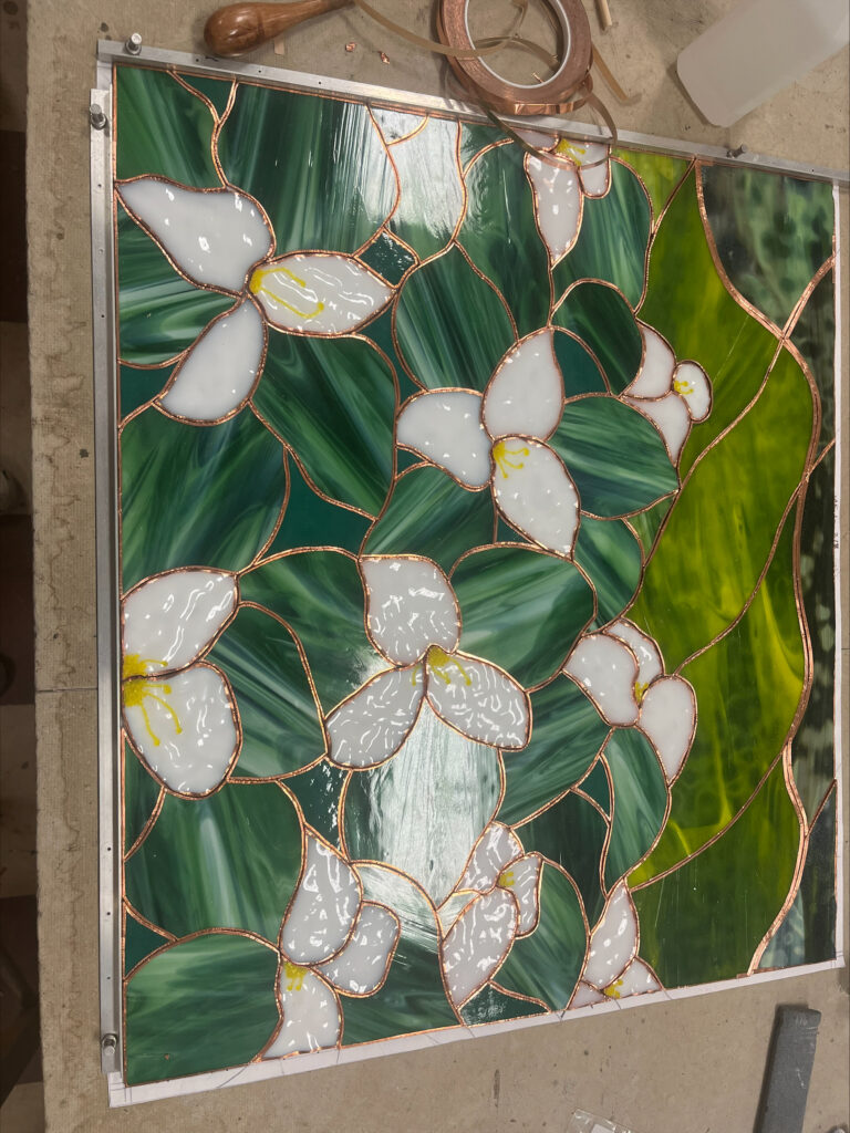 Close up view of the stained glass wall at the First Commerce Center for Compassionate Care under construction at the FSU Master Craftsman Studios
