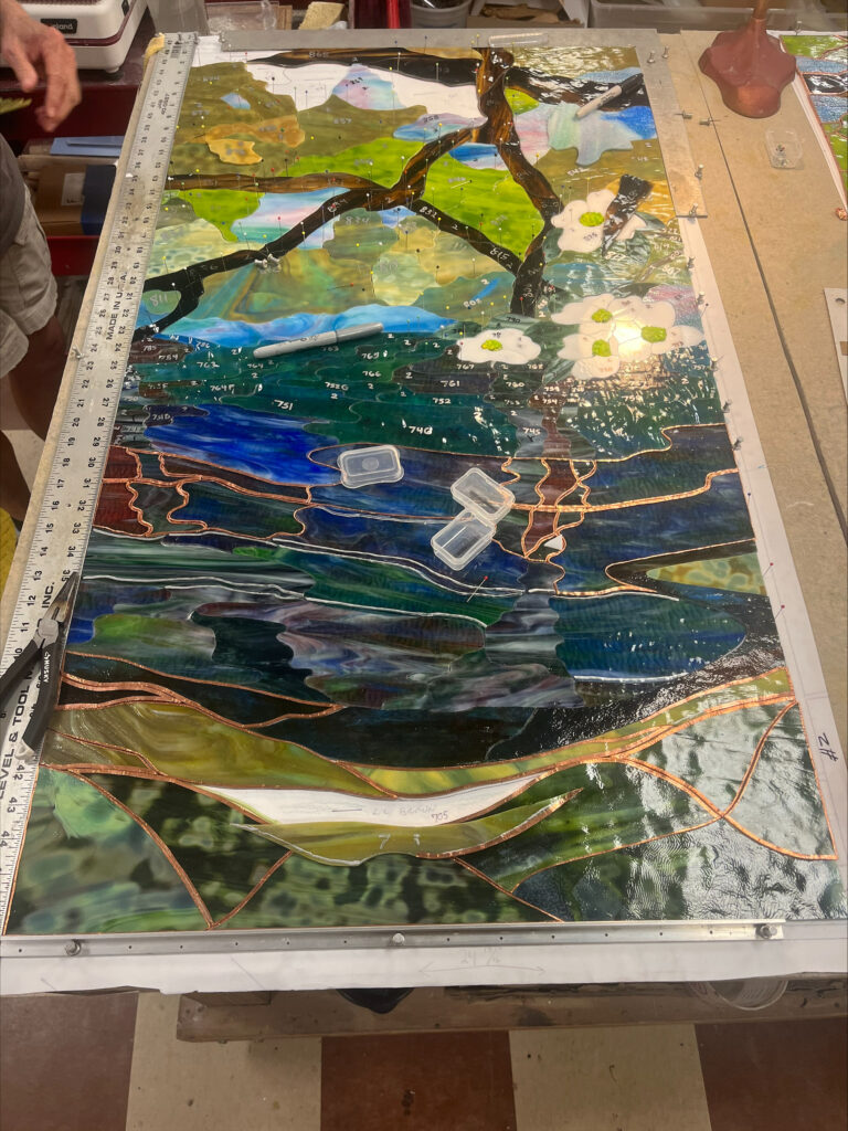 Close up view of the stained glass wall at the First Commerce Center for Compassionate Care under construction at the FSU Master Craftsman Studios