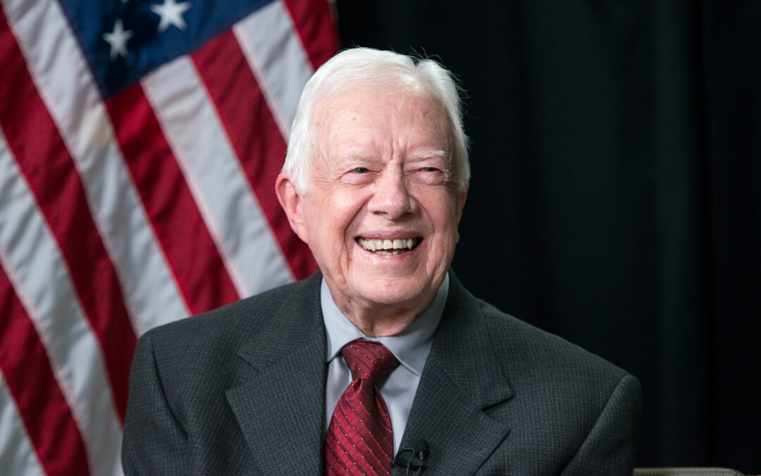 Image of former president Jimmy Carter in front of american flag